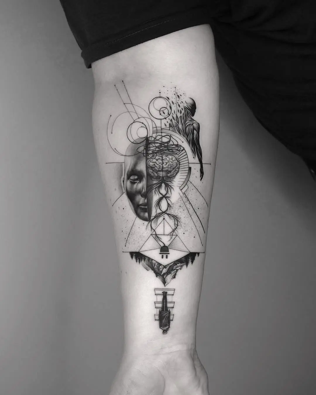 Striking black-and-white geometric forearm tattoo