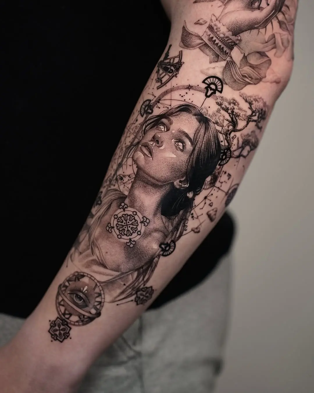 Intricate forearm tattoo showcasing a serene portrait