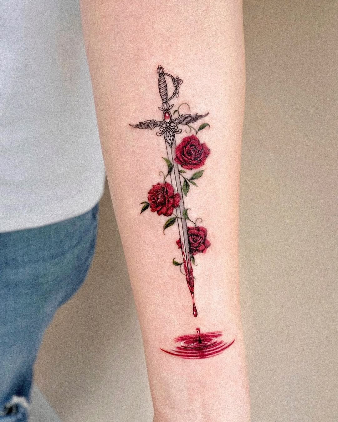 Elegant sword intertwined with vibrant roses