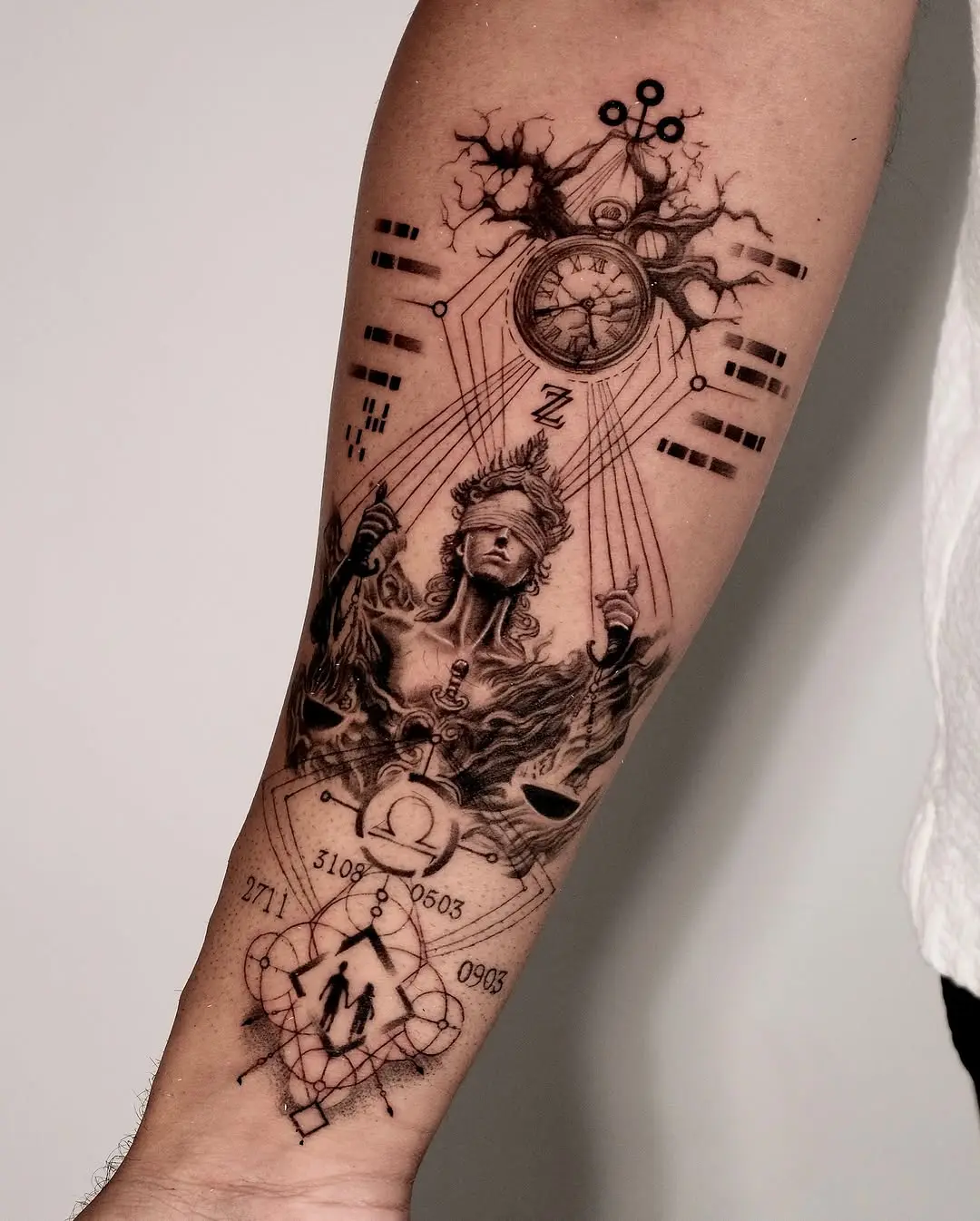 Intricate forearm tattoo blending time and space.