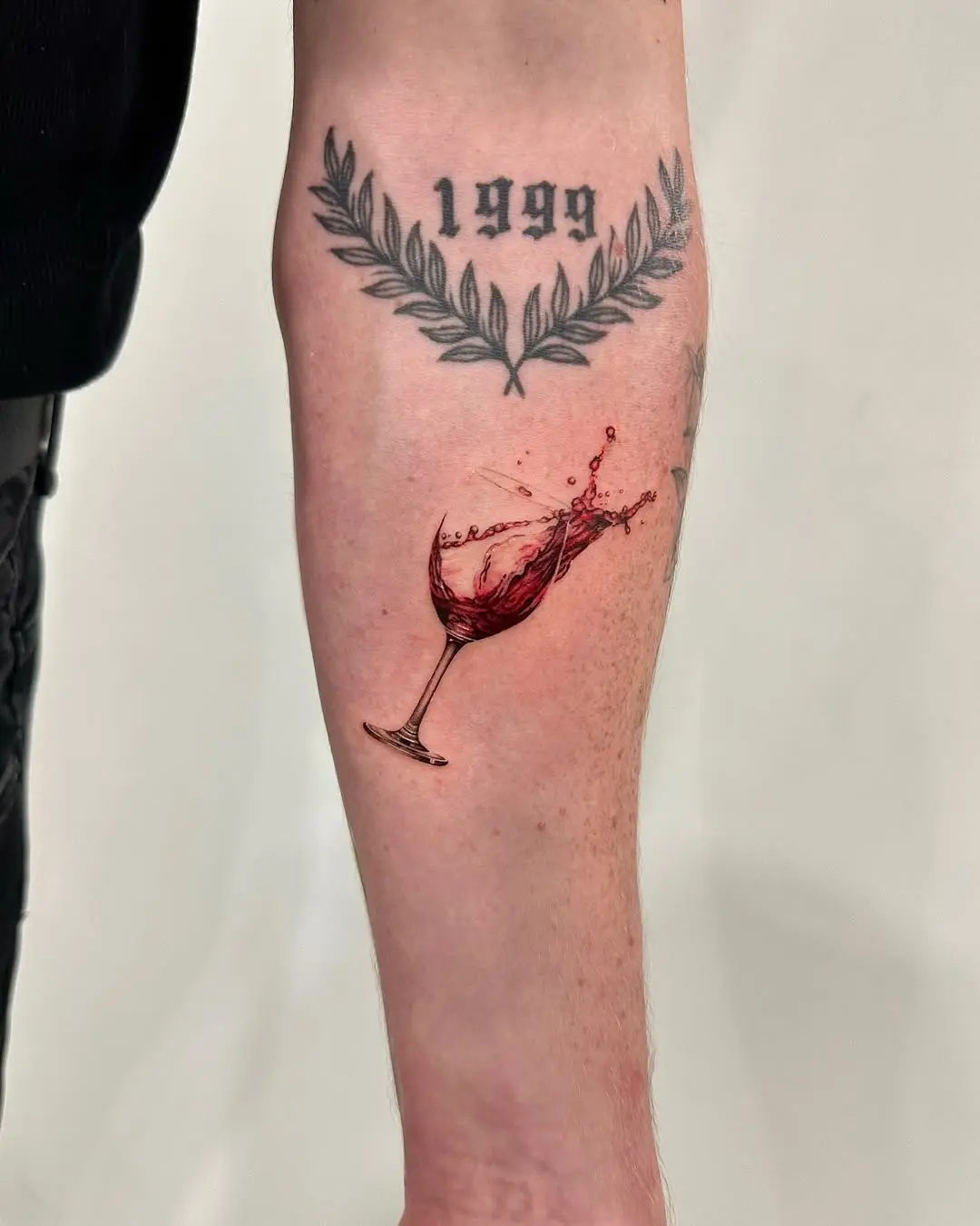 Artful representation of a wine glass tattoo