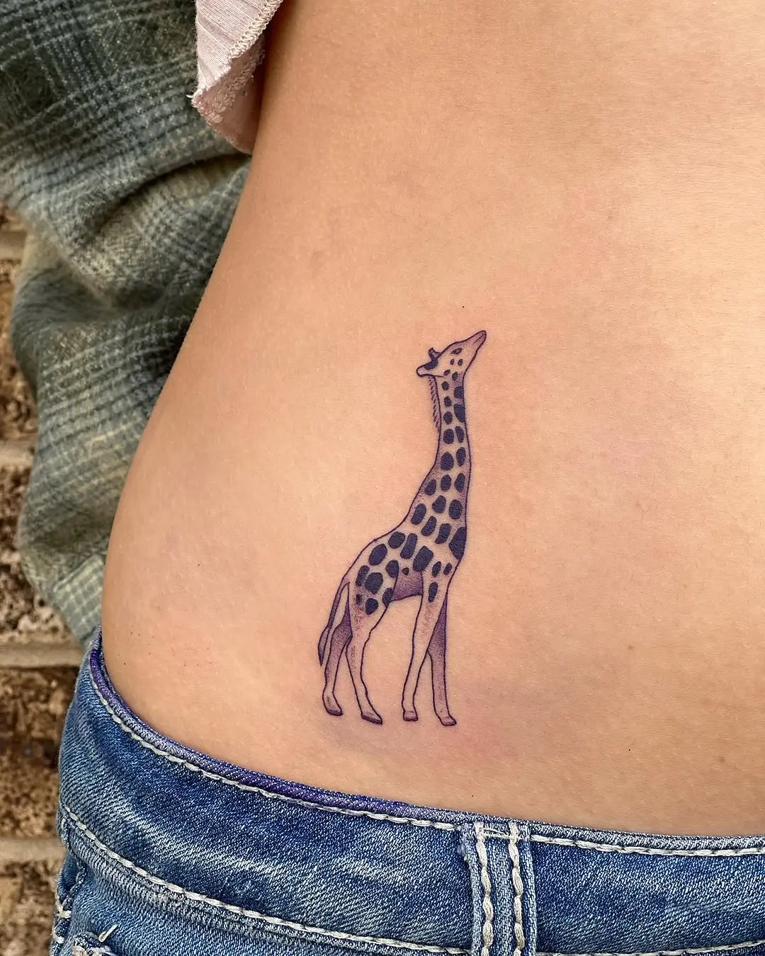 Charming giraffe tattoo on the side body