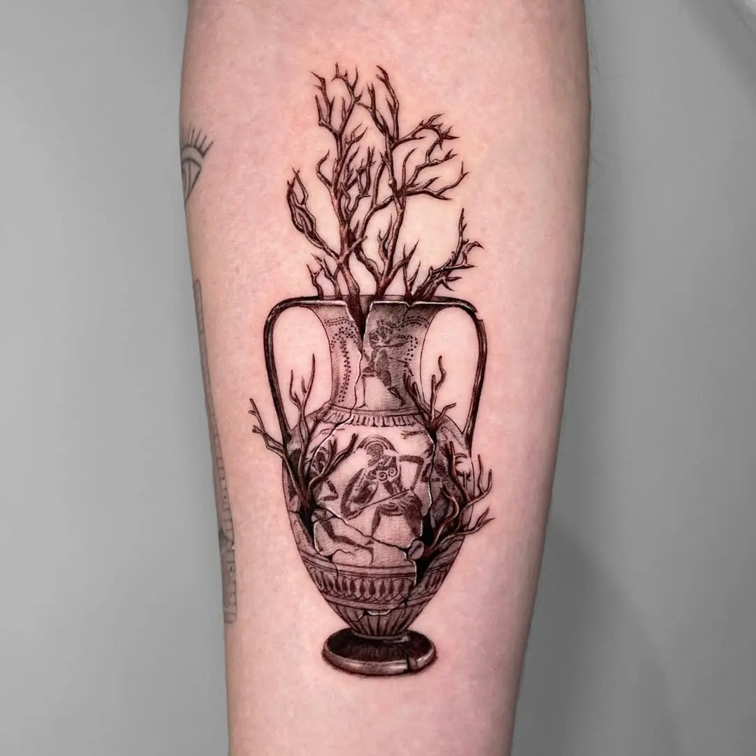 Artistic tattoo of a vase with branches