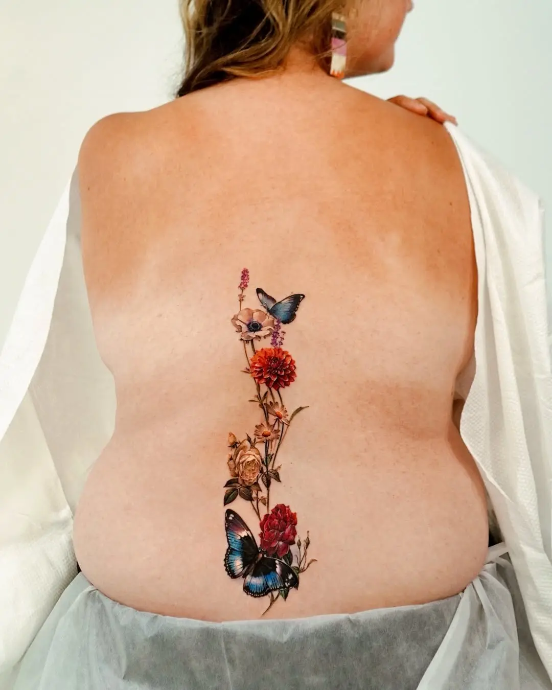 Beautiful floral and butterfly growth tattoo design