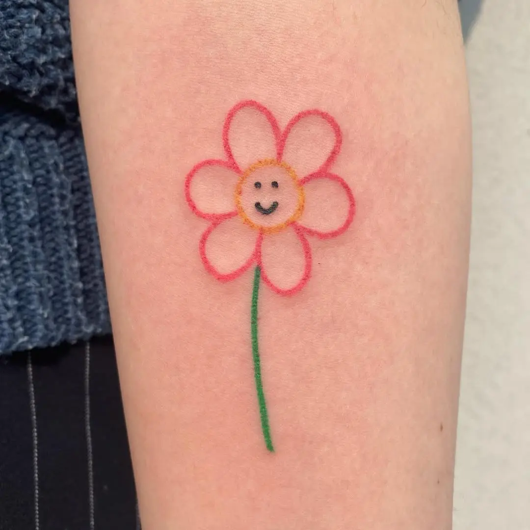 Charming smiley flower tattoo for positivity