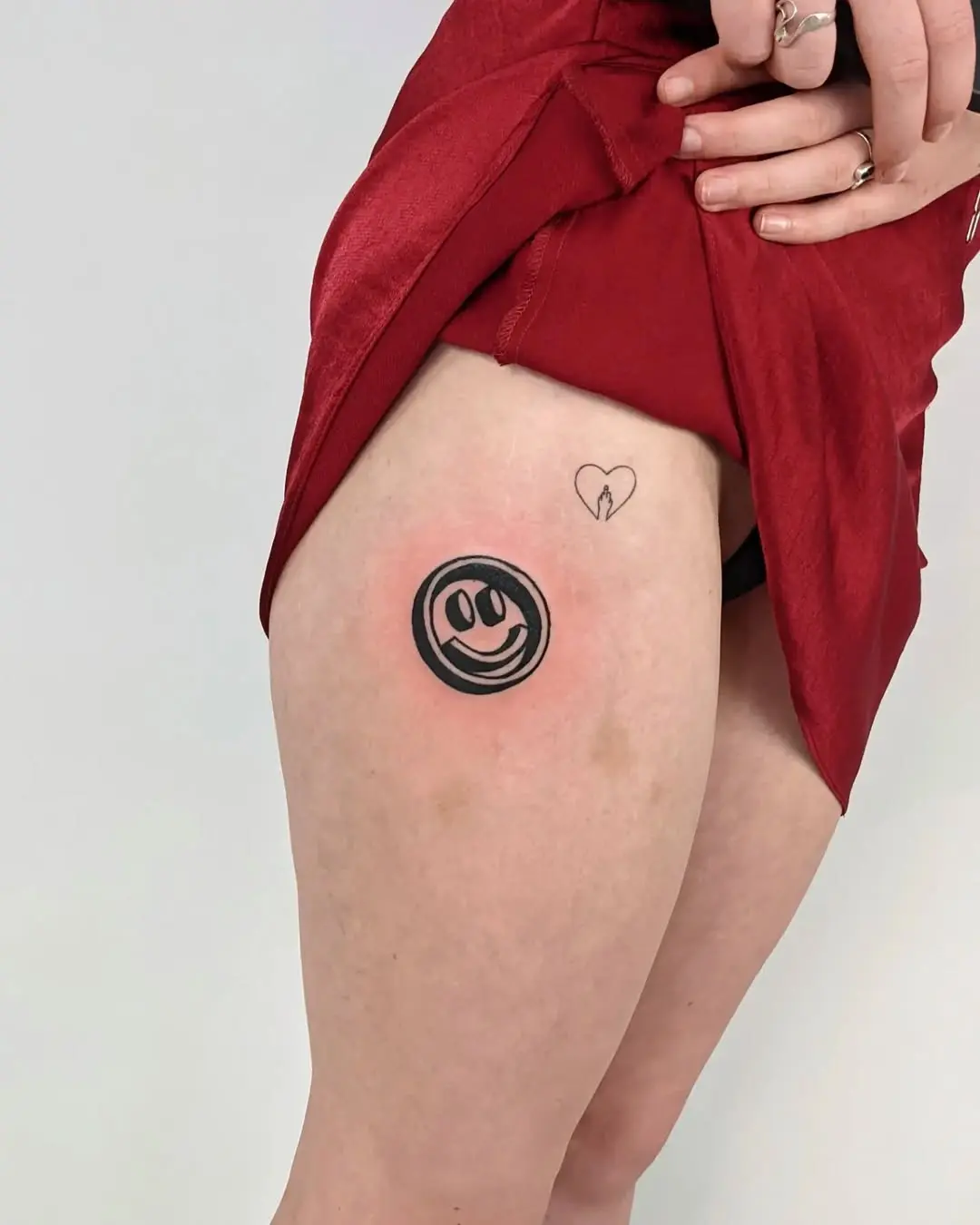 Joyful smiley face tattoo brings happiness