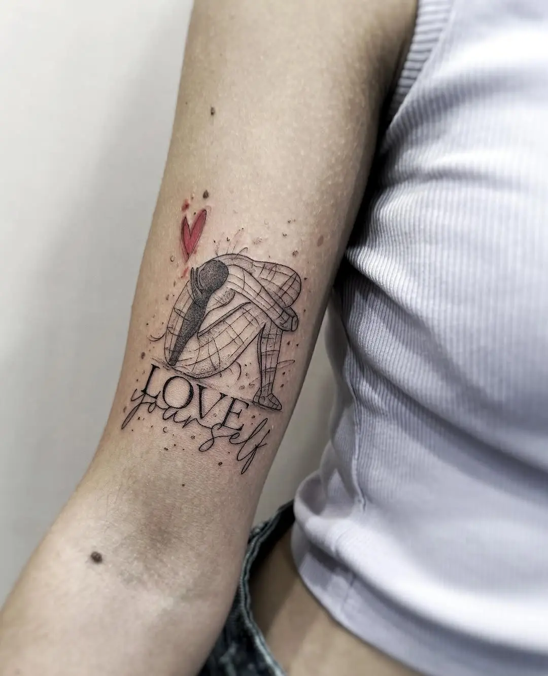 Inspirational tattoo promoting self-love and acceptance
