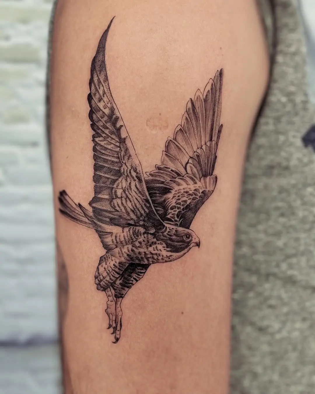 Dynamic hawk tattoo showcasing natural elegance