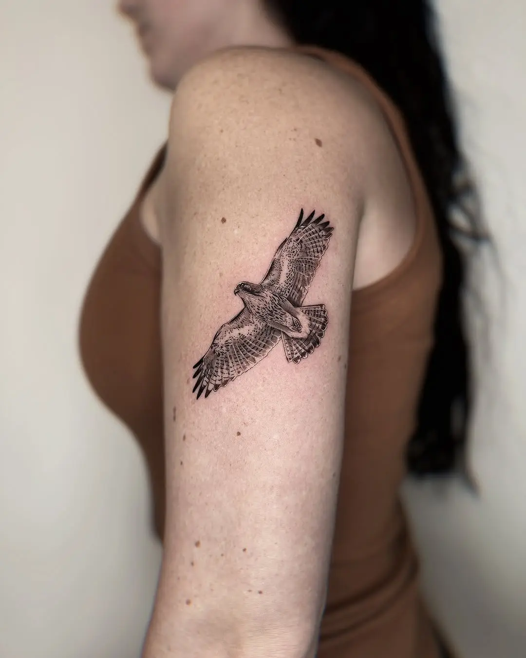 Stunning hawk tattoo capturing graceful flight