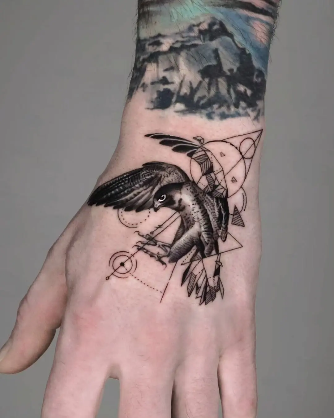 Intricate hawk tattoo with geometric elements