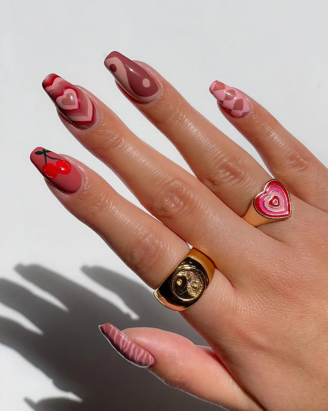 Charming mauve nails with playful designs