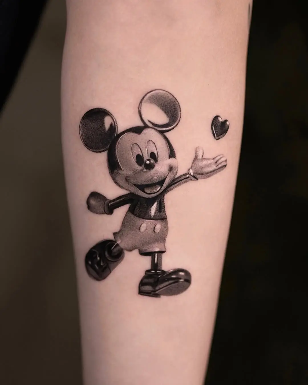 Charming Mickey Mouse Tattoo with Heart Gesture