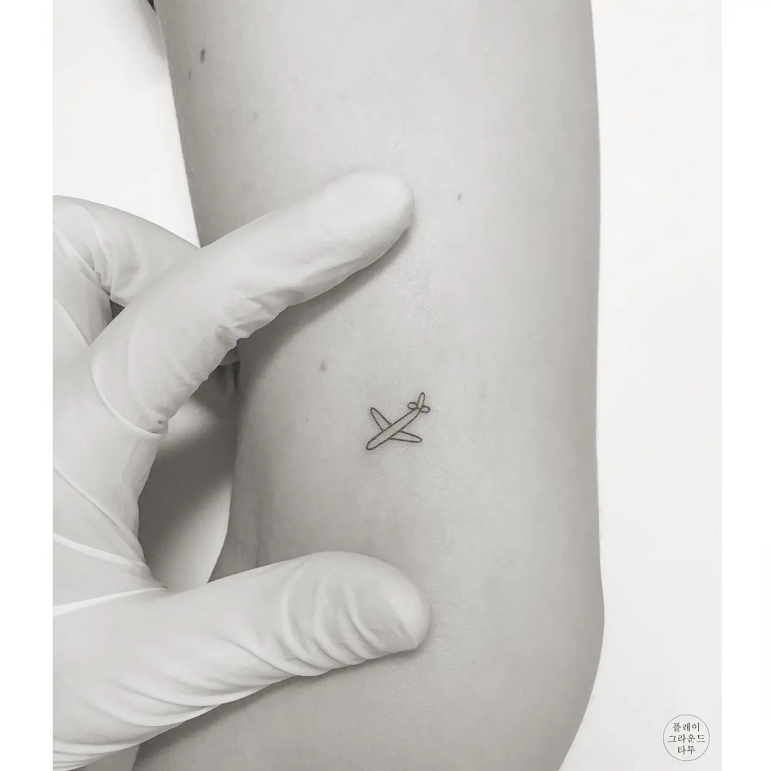Chic Minimalist Airplane Tattoo Design
