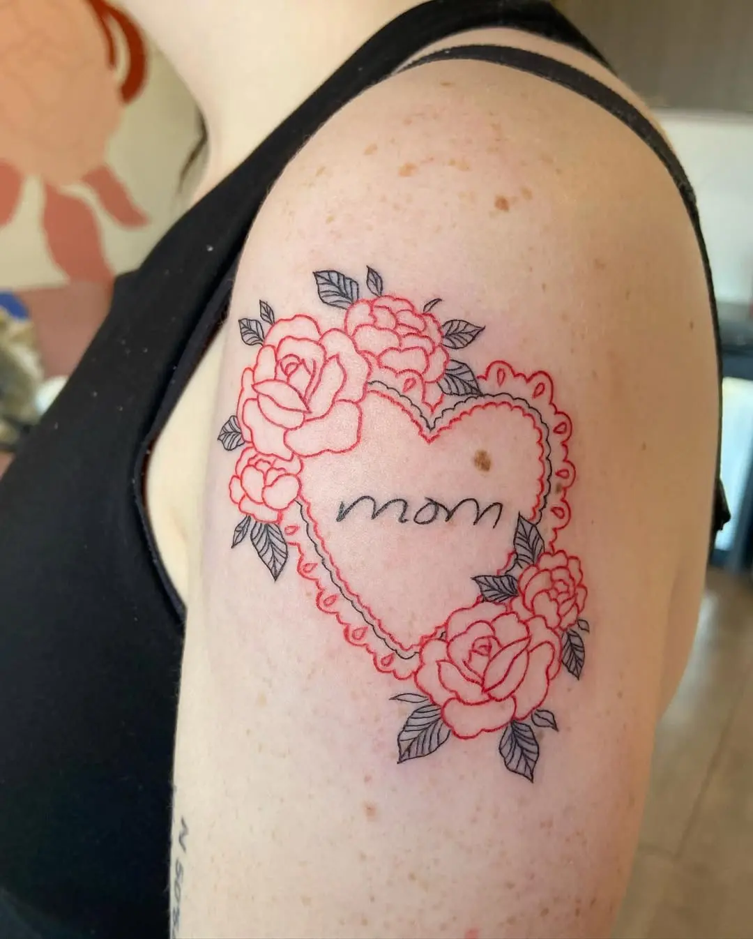 Heartfelt floral tattoo tribute to mothers