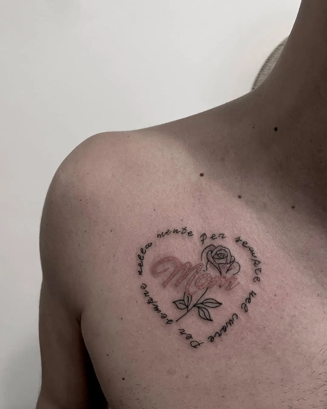 Heartfelt mom tattoo with rose accent