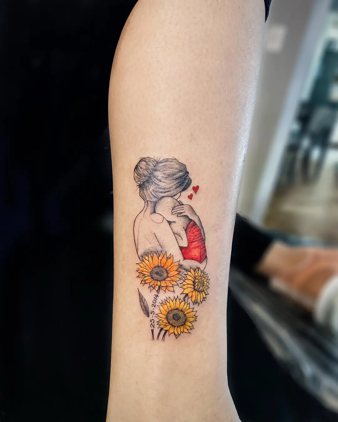 A heartfelt tattoo celebrating motherhood and love