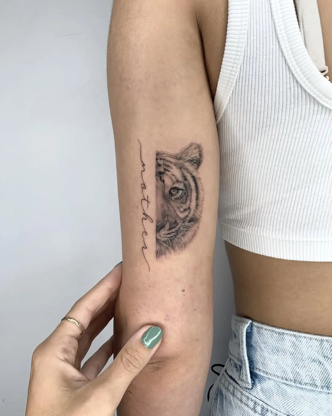 Stunning tattoo of a tiger with 'mother' script