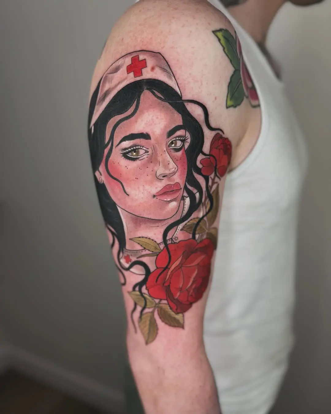 Intricate nurse tattoo with floral elements