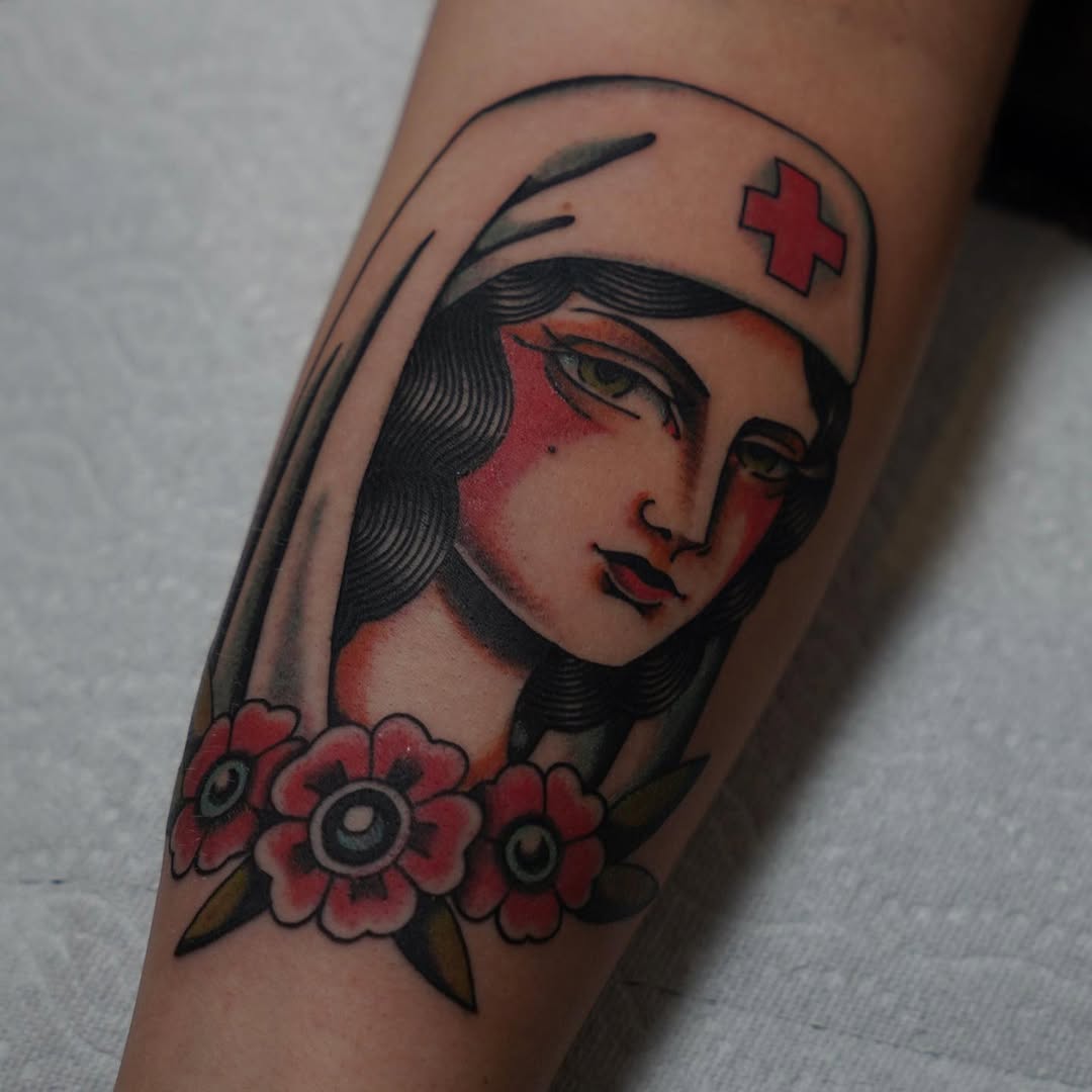 Classic nurse tattoo with a floral twist