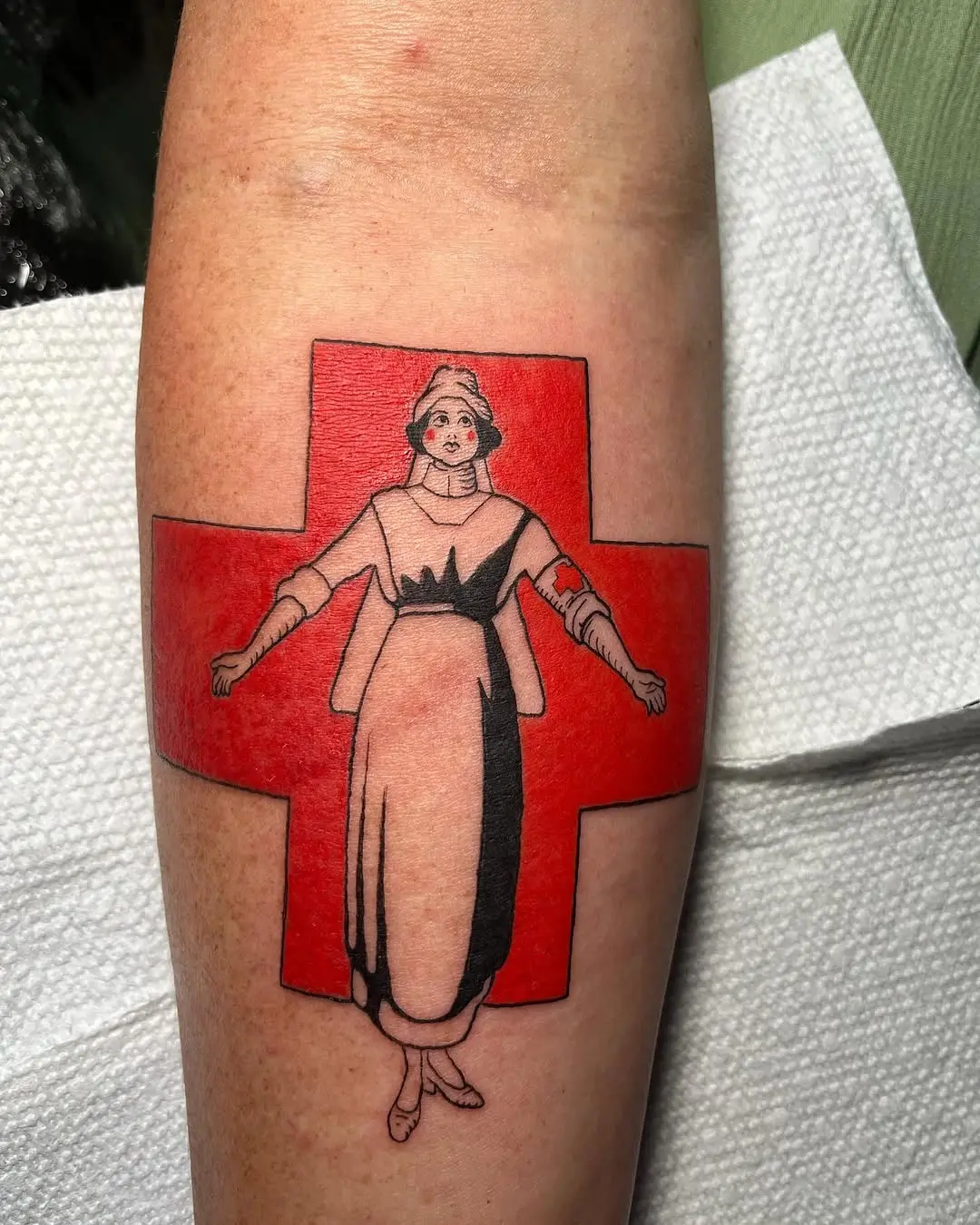 Vintage nurse tattoo with red cross background