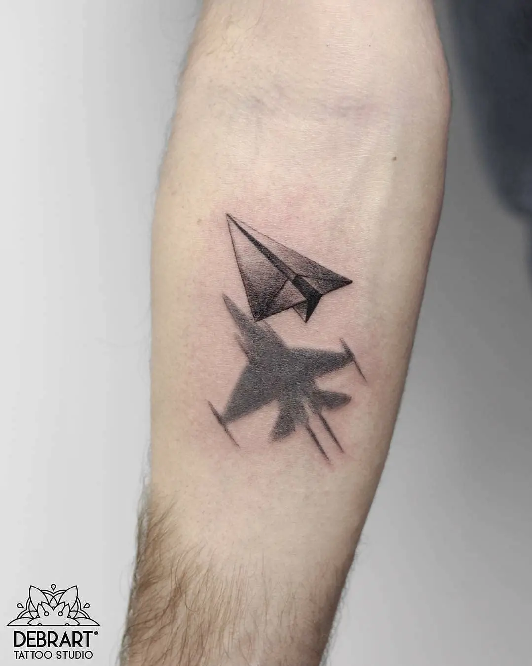 Unique jet and paper plane tattoo design