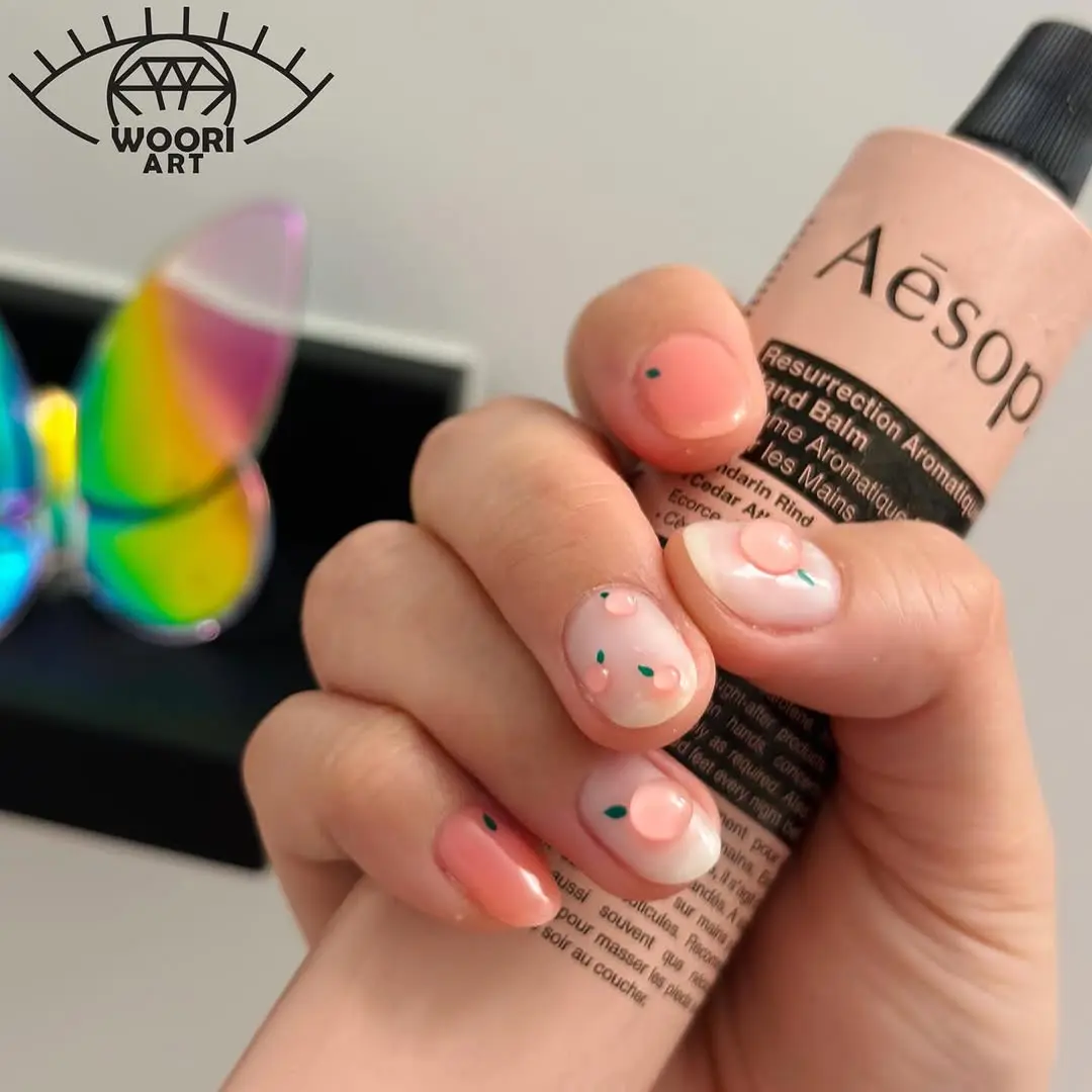 Charming peach nails with playful colorful accents