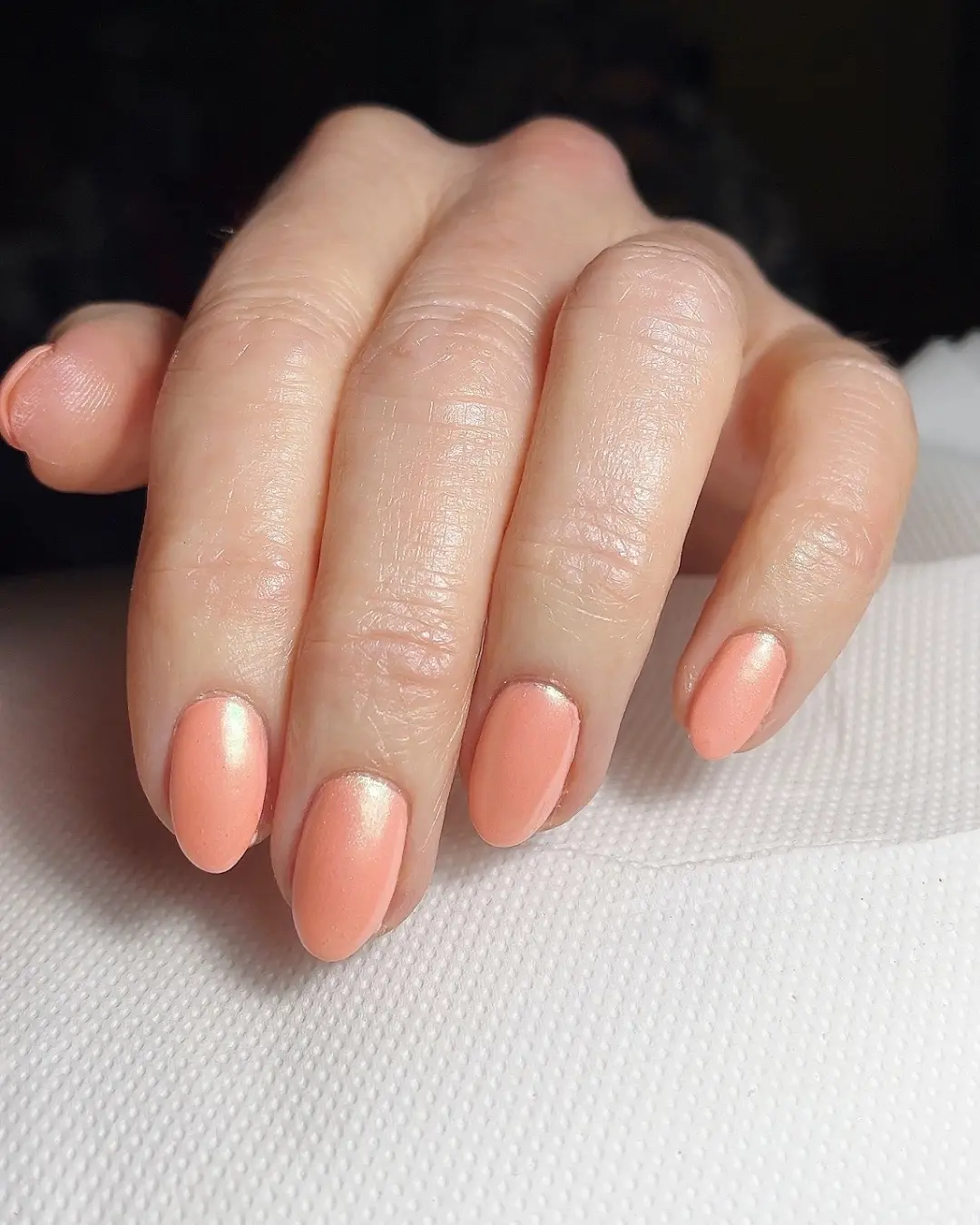 Glistening peach nails for a fresh vibe