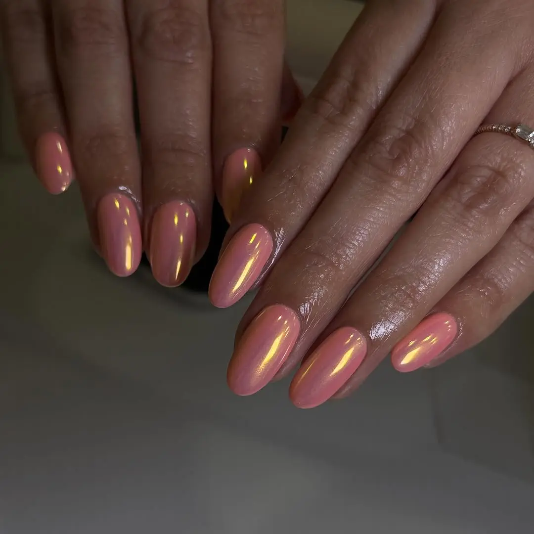 Stylish peach nails with a glossy finish