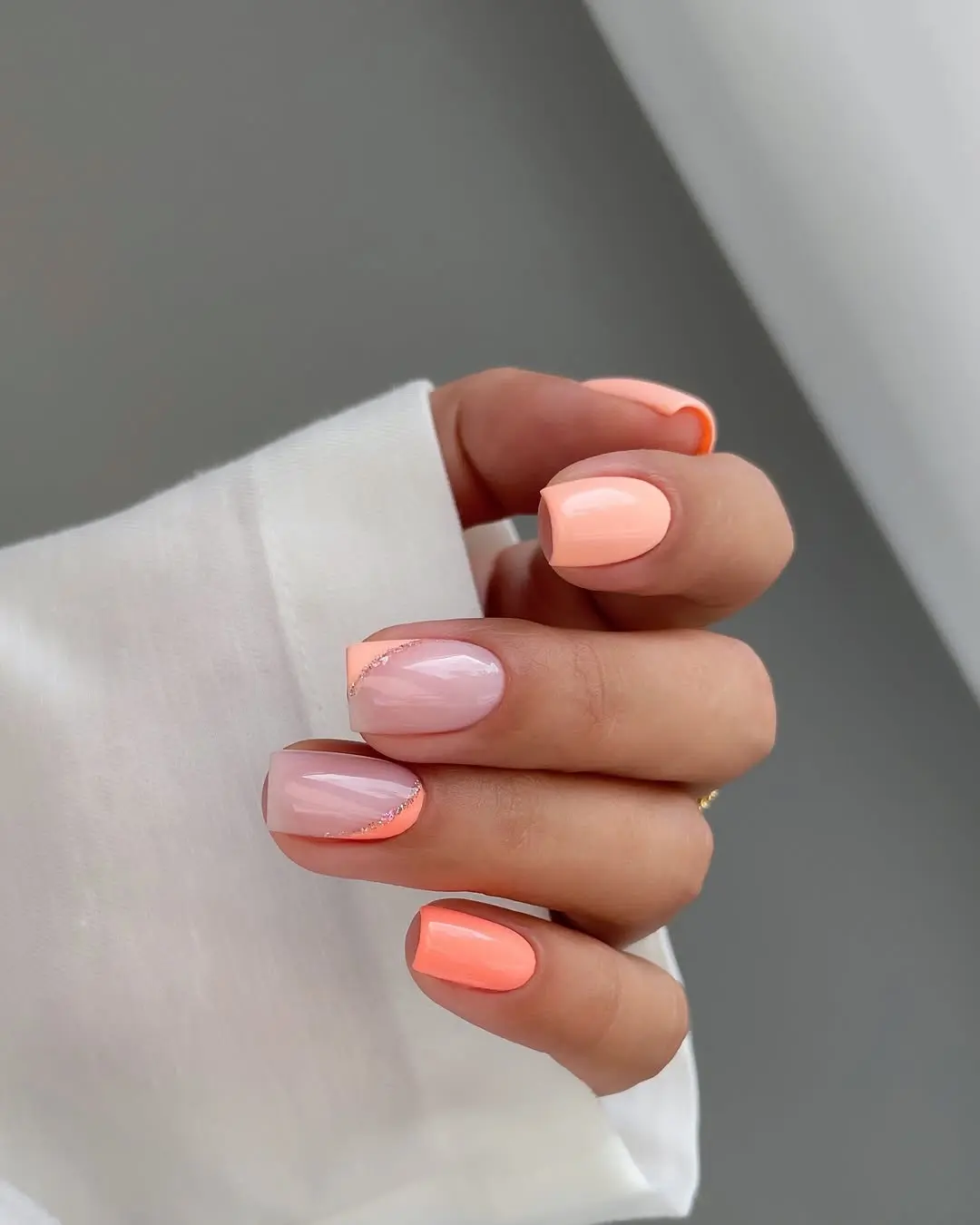 Stylish summer peach nails with unique design