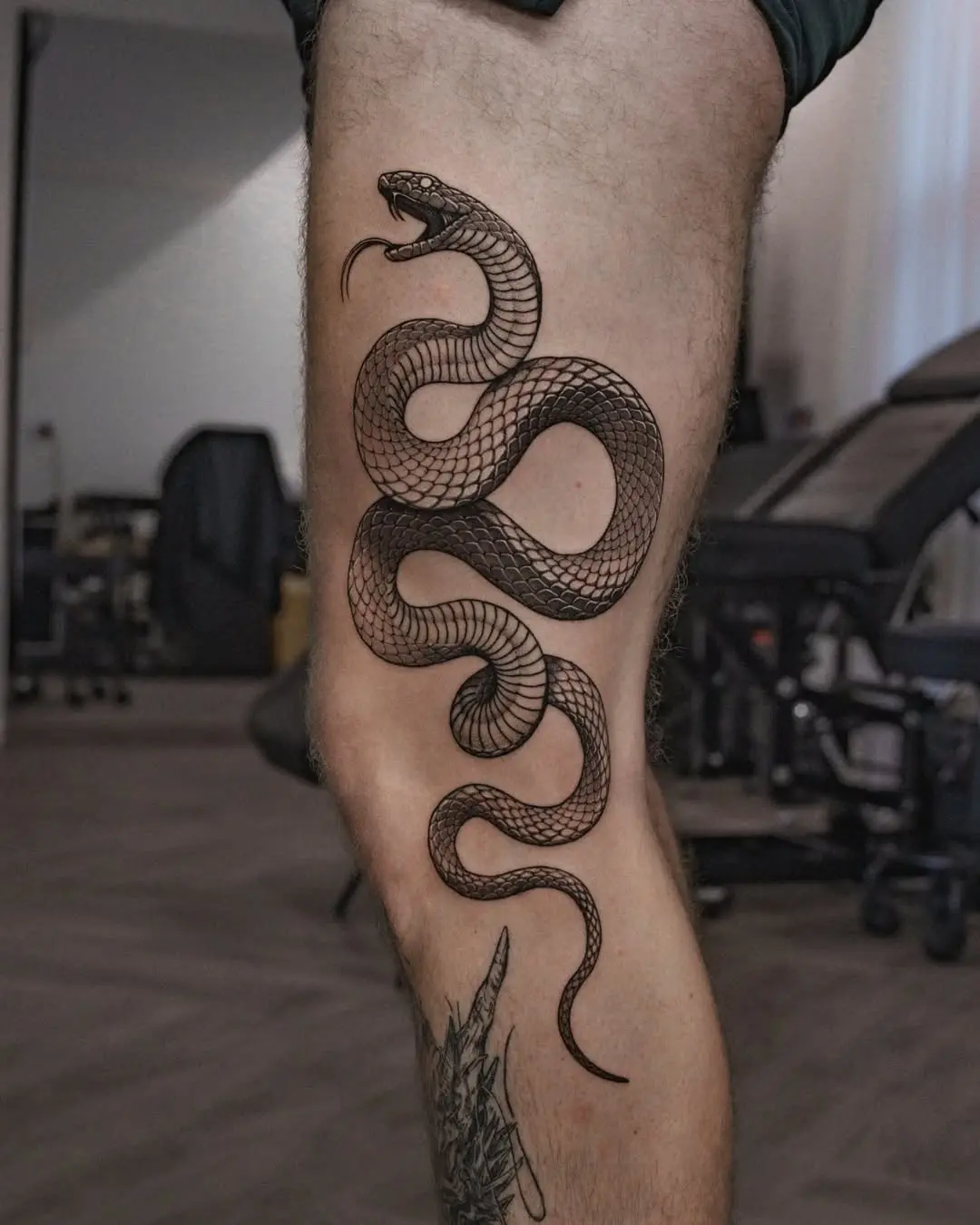 Stylish snake tattoo that slithers elegantly