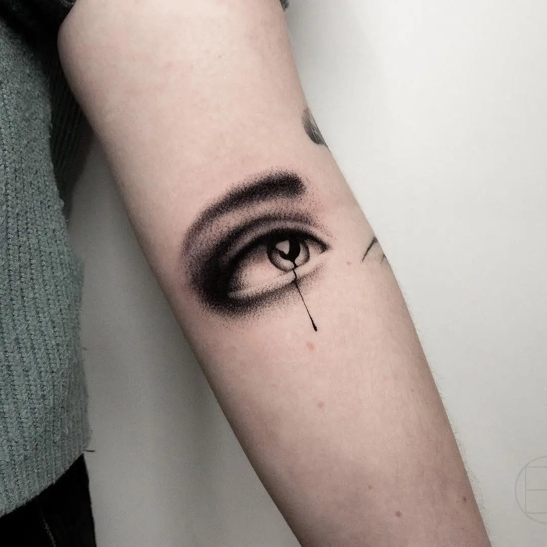 Realistic eye tattoo with dramatic shading