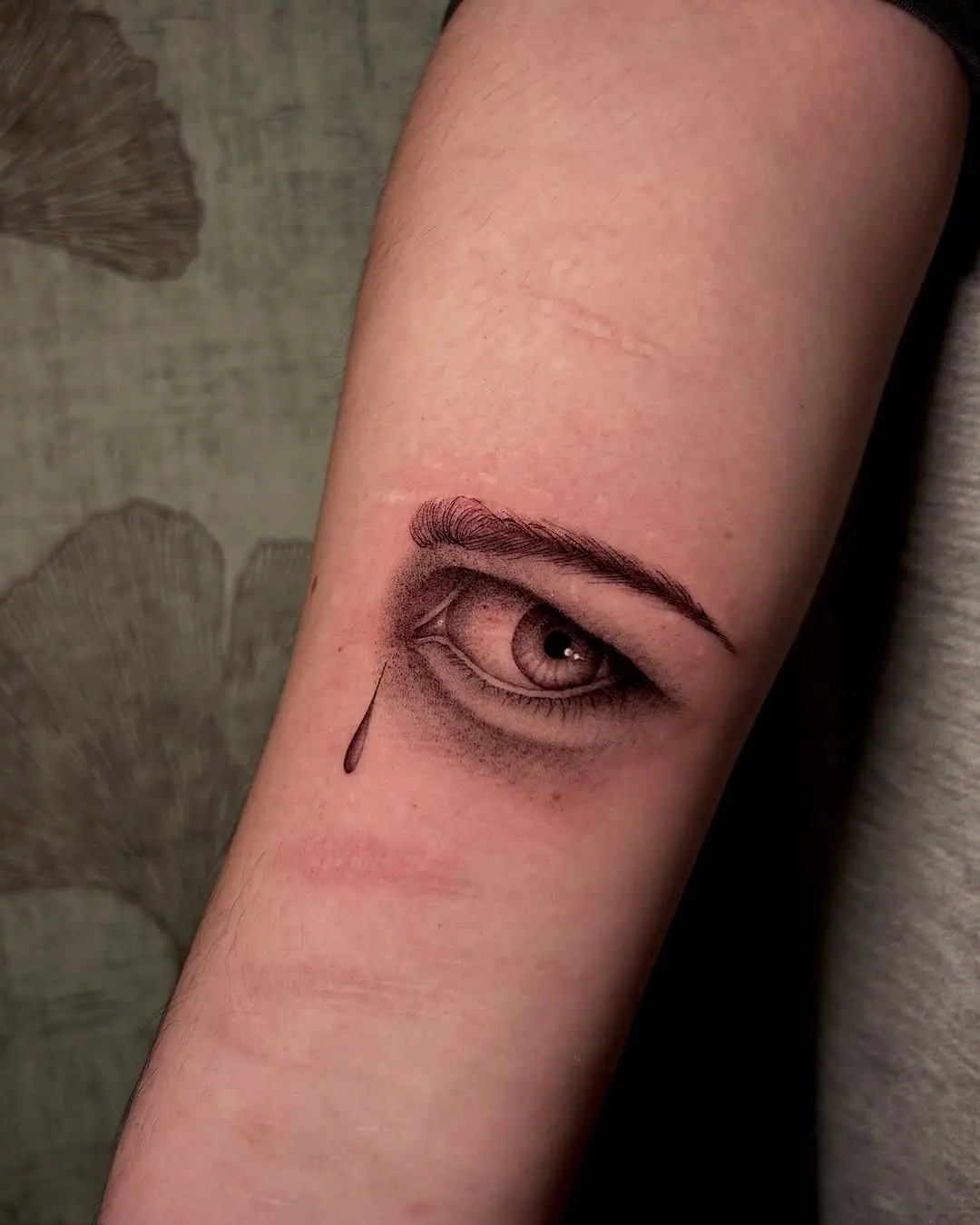 Intricate Eye Tattoo with a Dramatic Touch