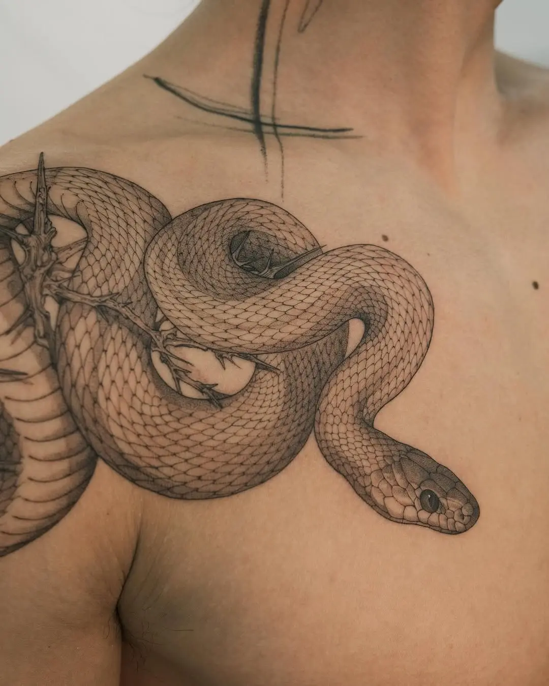 Intricate Snake Tattoo on Shoulder with Depth