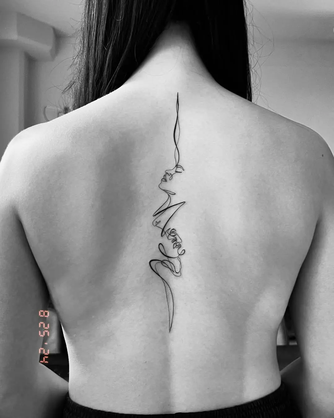 Elegant line art spine tattoo design