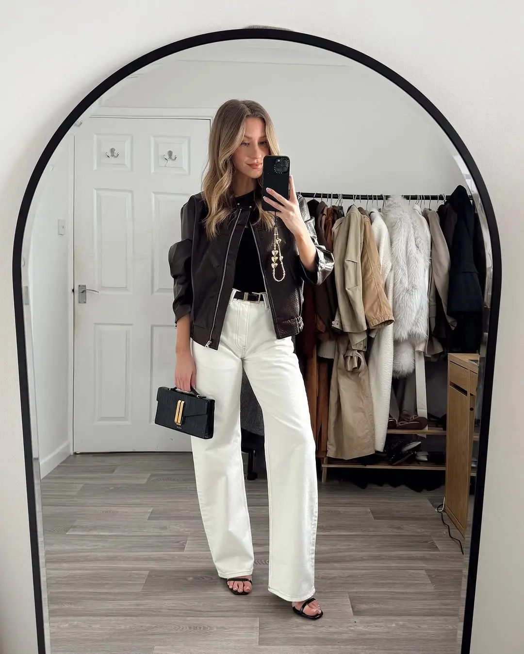 Chic White Pants Look with Black Jacket