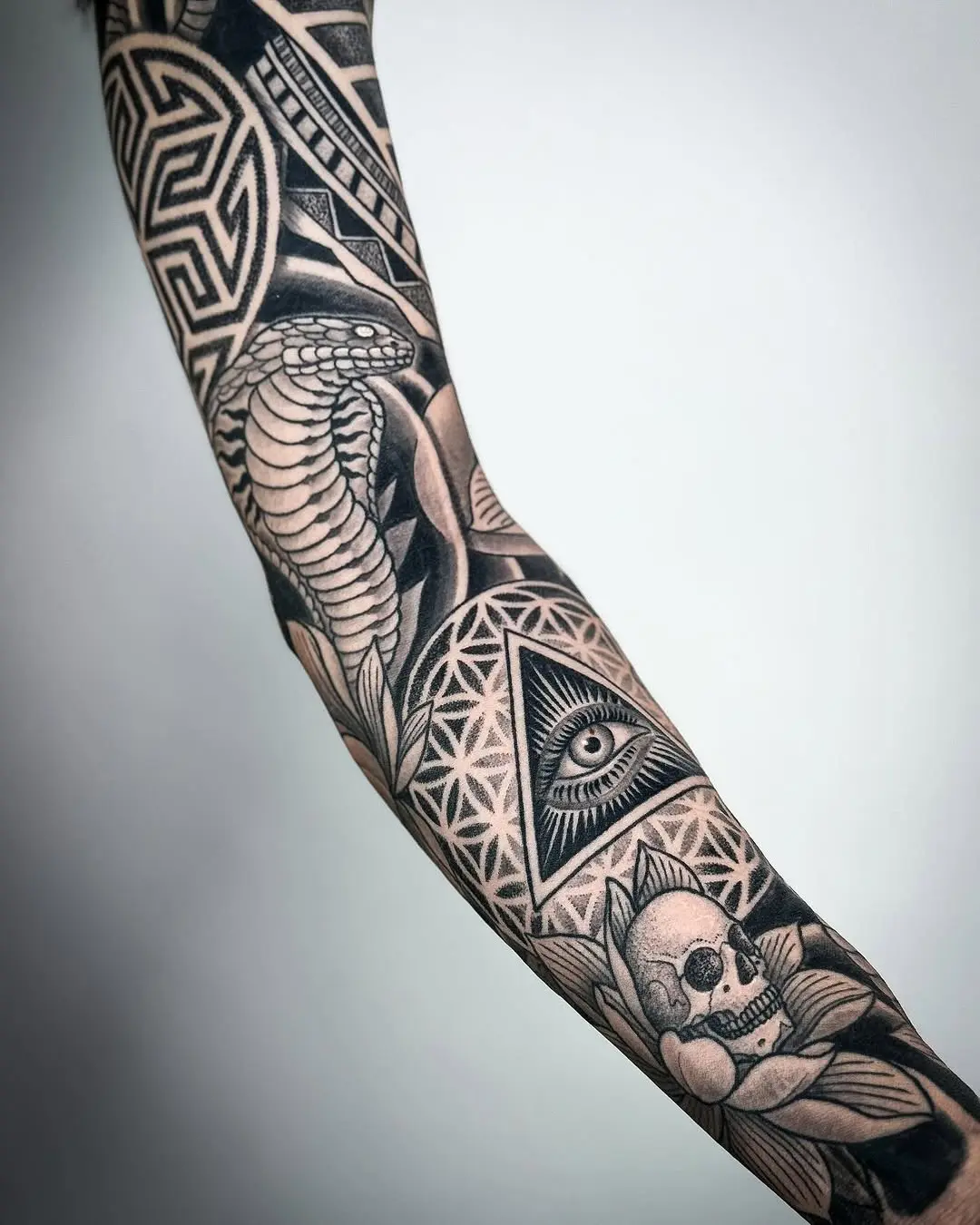 Intricate Egyptian-Inspired Tattoo Sleeve Design