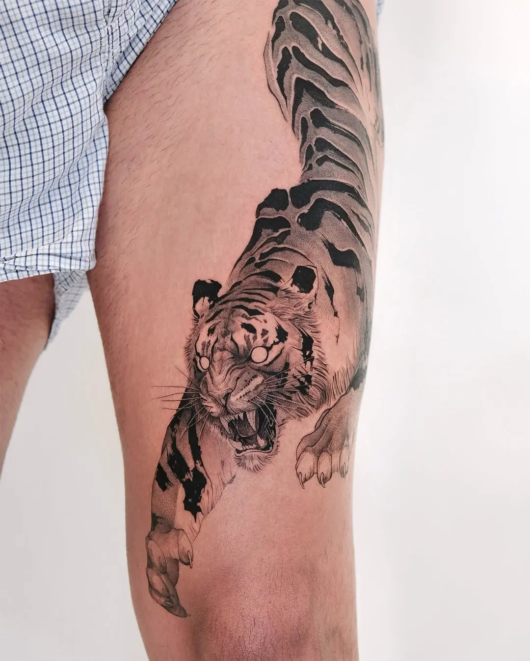 Fierce tiger tattoo design on thigh