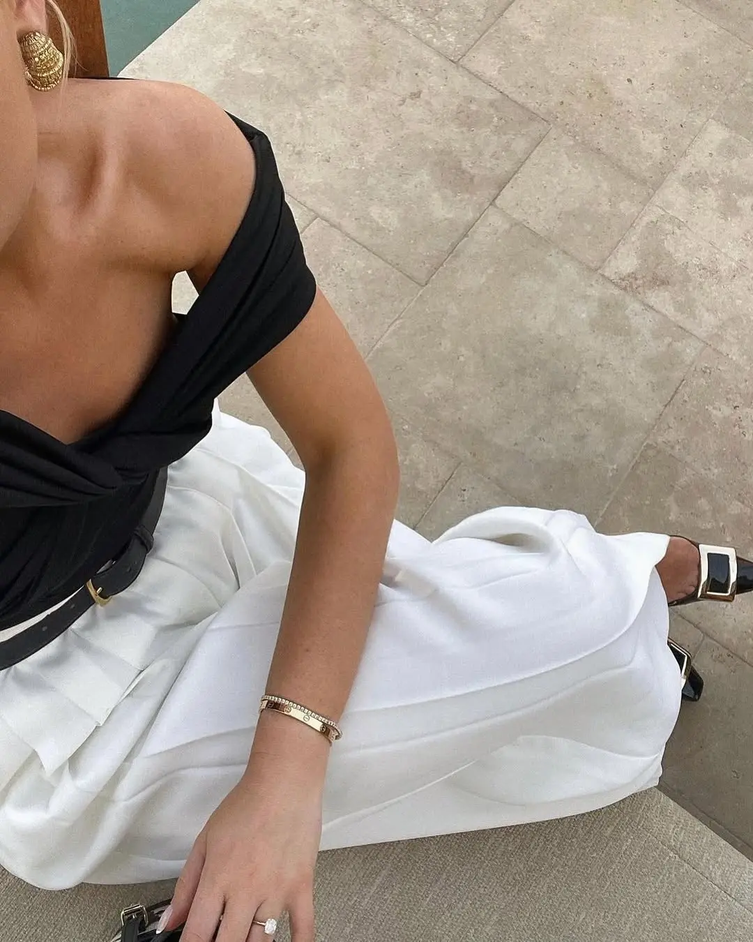 Chic off-shoulder look with white pants