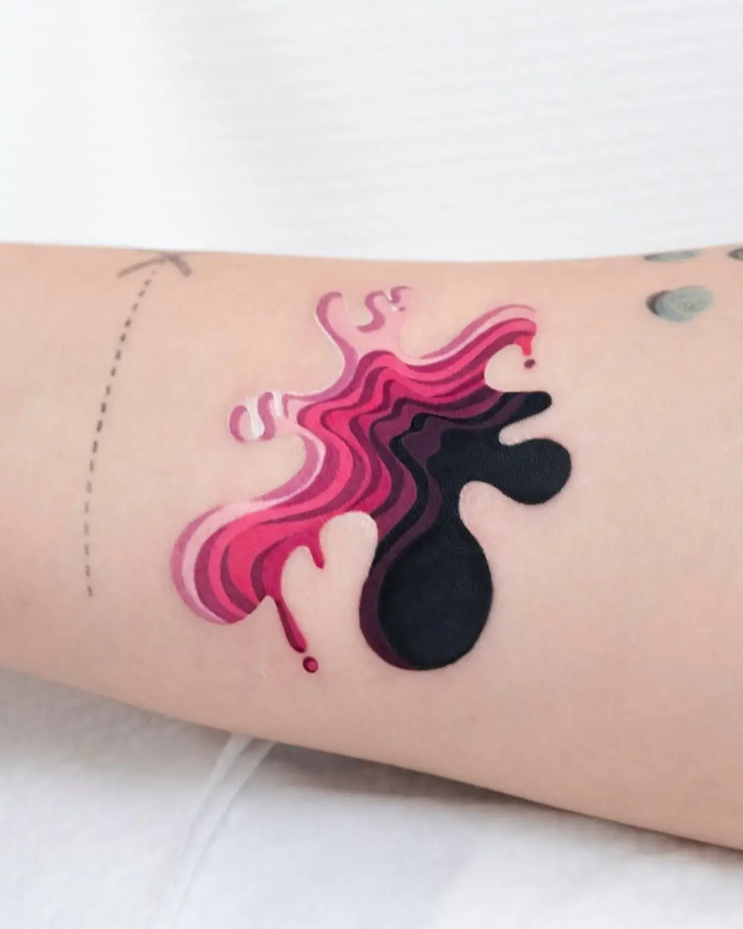 Vibrant abstract splash tattoo with dynamic shapes