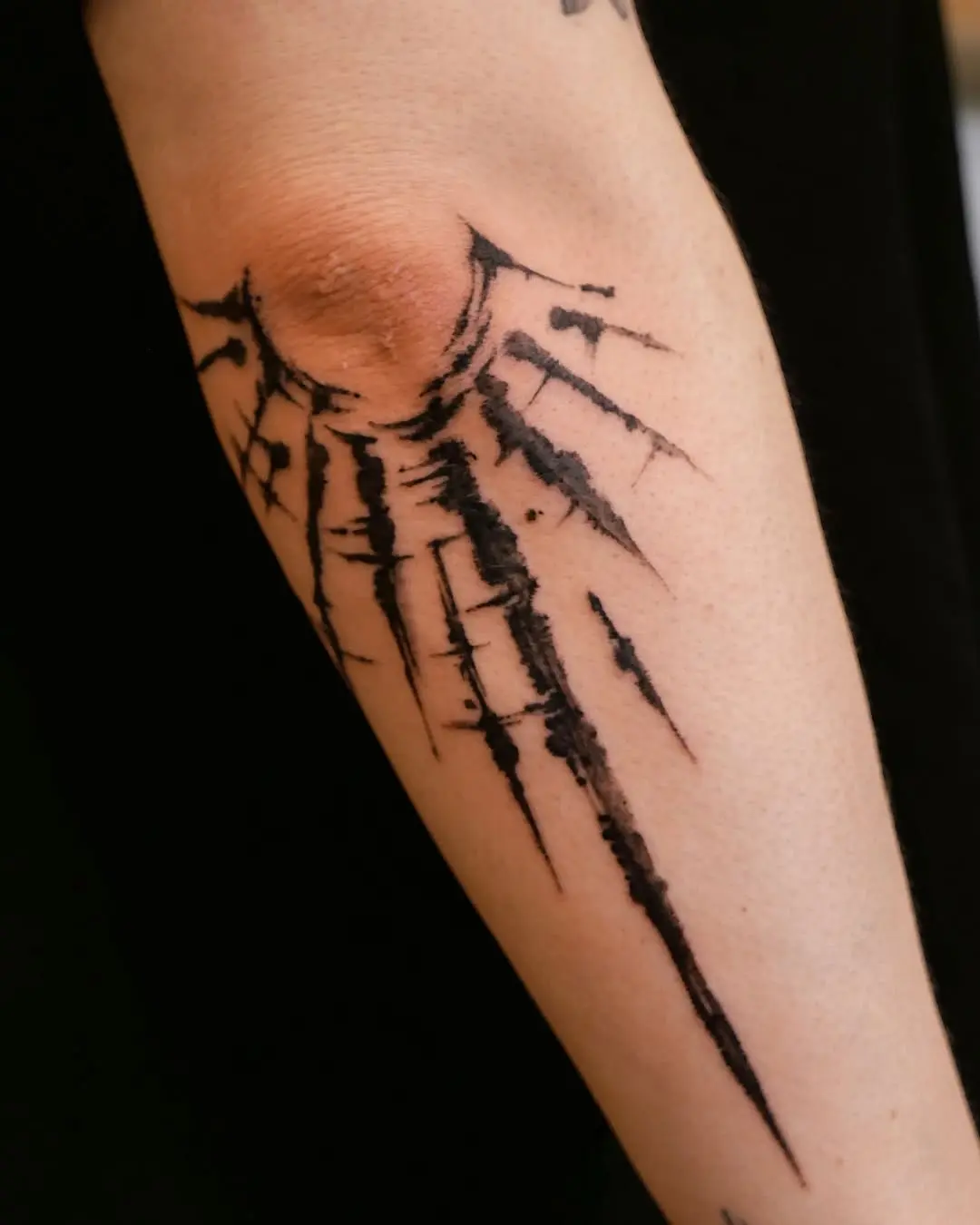 Dynamic Sun Rays Tattoo Design on Forearm