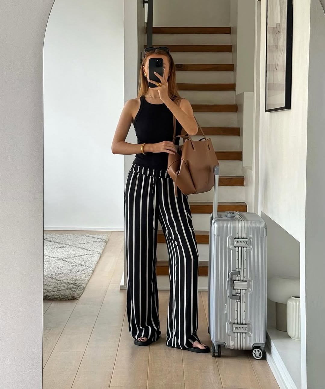 Chic striped outfit for stylish travel vibes