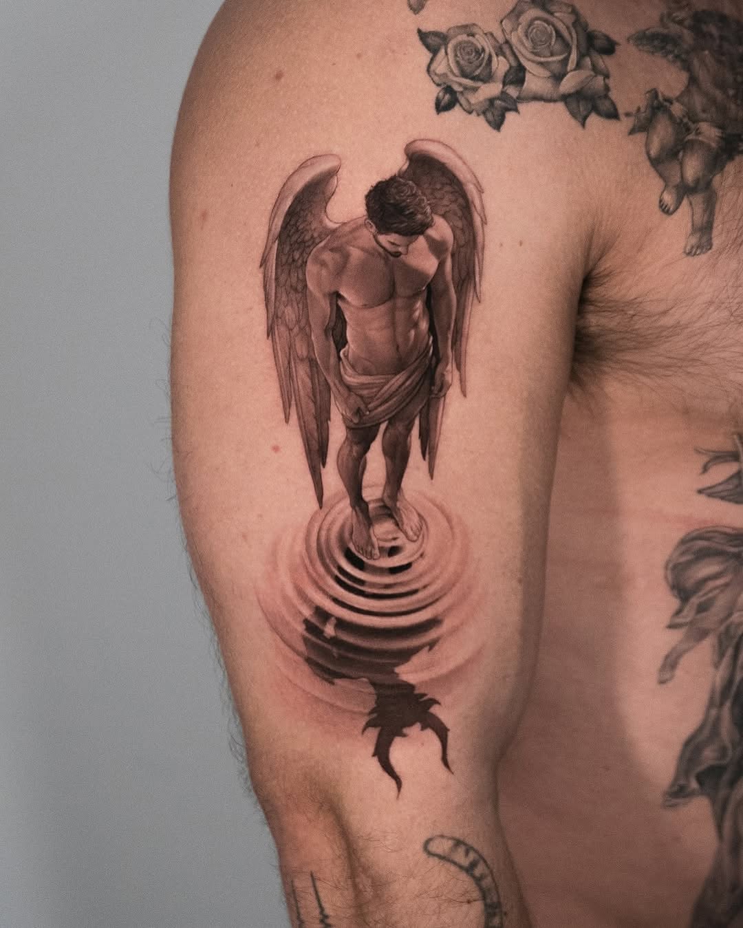 Stunning angel tattoo with reflective water effect