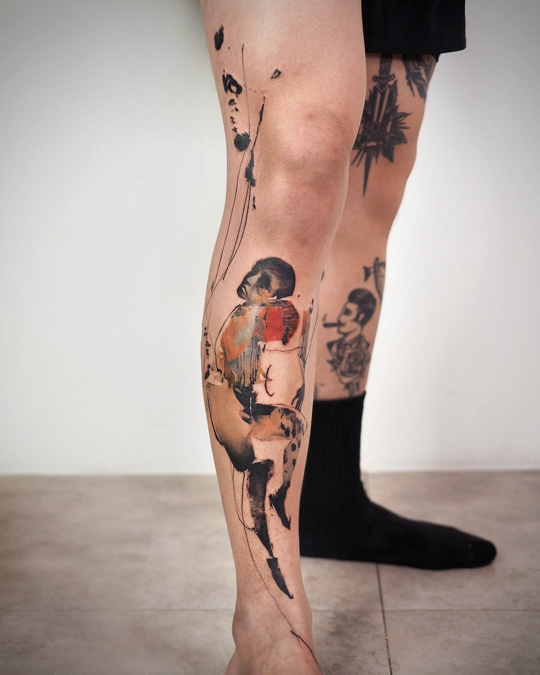 Unique artistic leg tattoo with vibrant colors