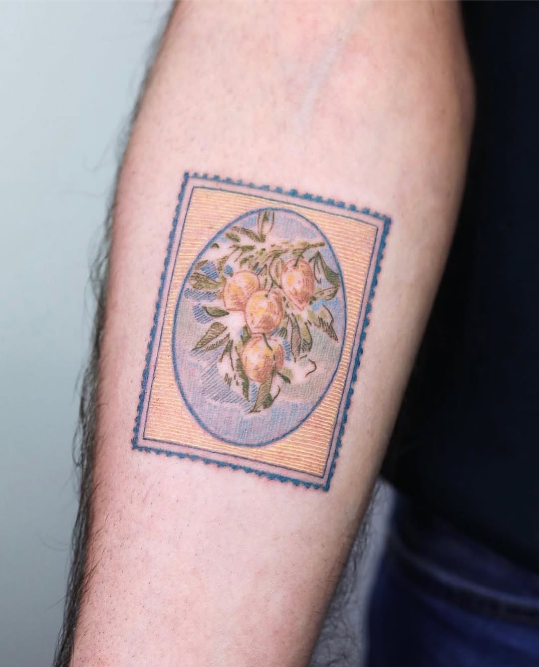 Unique peach floral tattoo design on arm