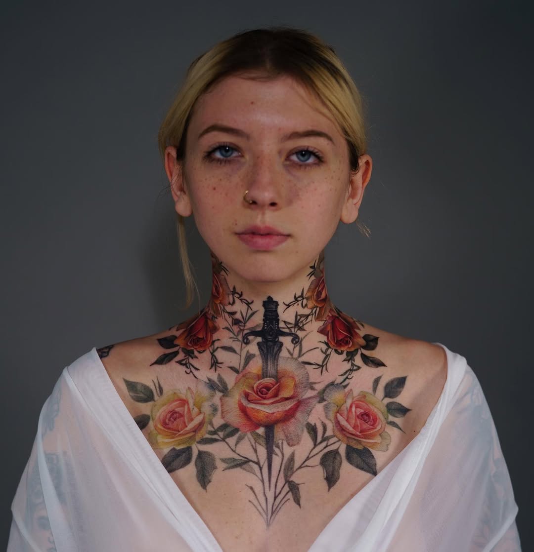 Stunning floral and dagger neck tattoo art