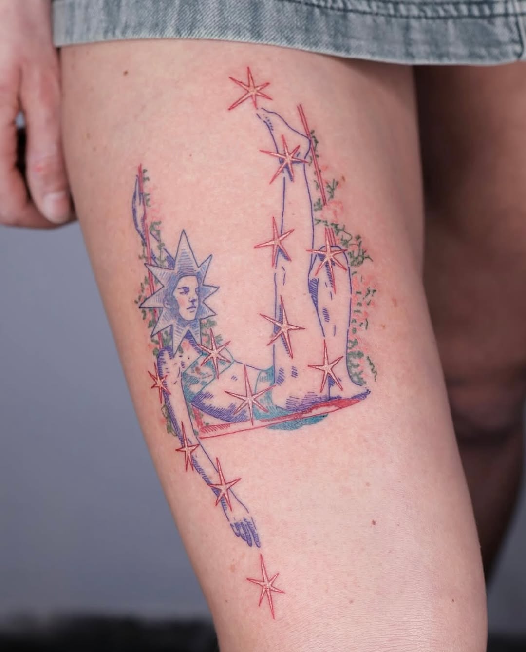 Celestial-inspired tattoo on thigh shines brightly