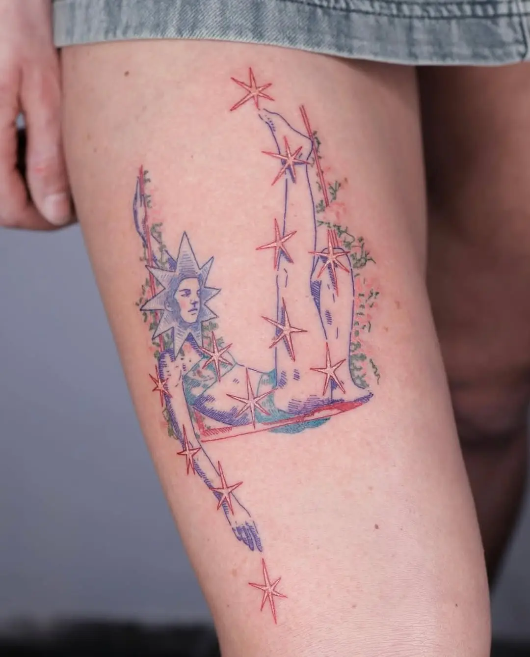 Celestial-inspired tattoo on thigh shines brightly