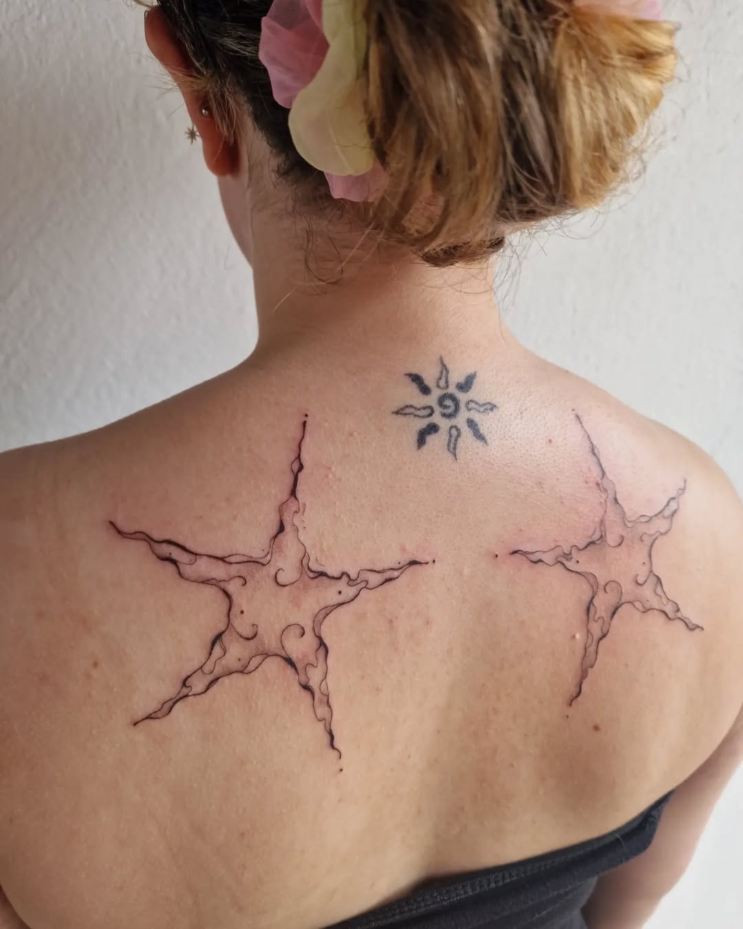 Intricate star tattoos with playful ink details