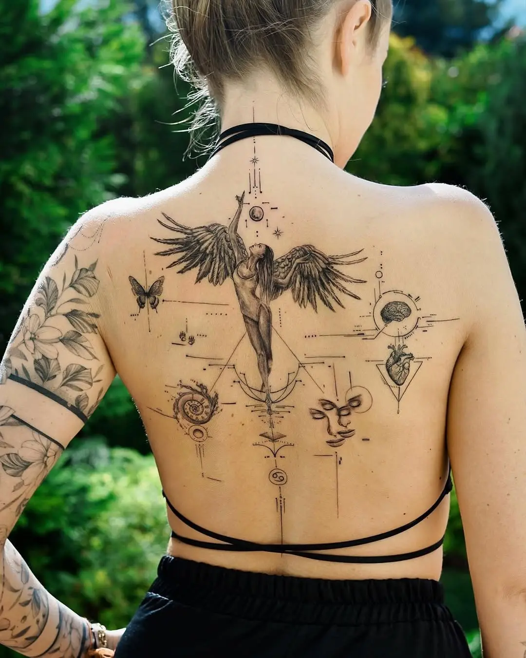 Stunning back tattoo with angelic wing designs
