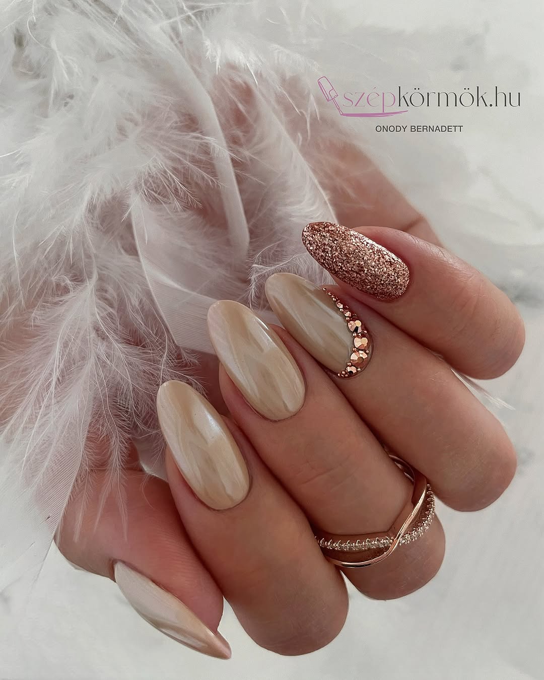 Elegant beige nails with glitter accent